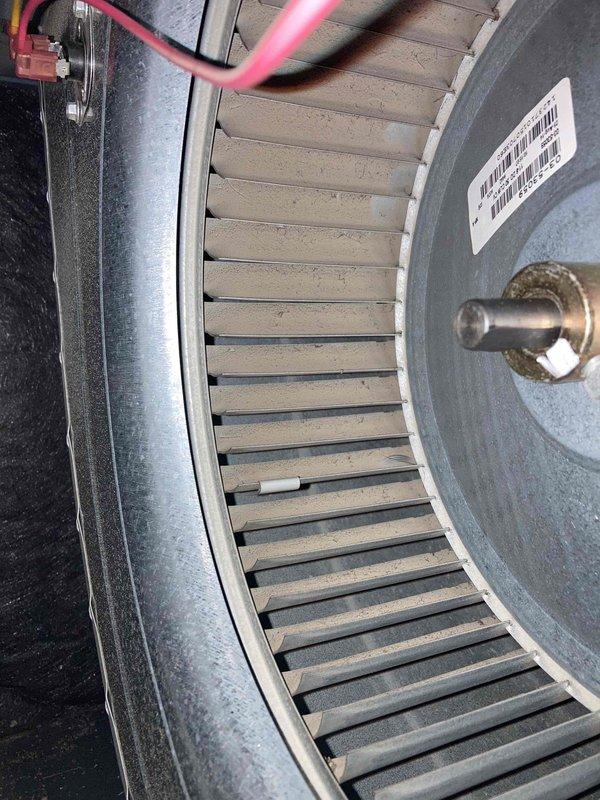 Completed scheduled AC tune-up and preventative maintenance on air conditioning system. Performed electrical diagnostics using clamp meter, measuring amperage draw at 0.78A and voltage readings to verify proper system operation. Inspected blower wheel assembly, noting moderate dust accumulation on squirrel cage fan blades and housing; cleaned and serviced blower components to ensure optimal airflow efficiency.