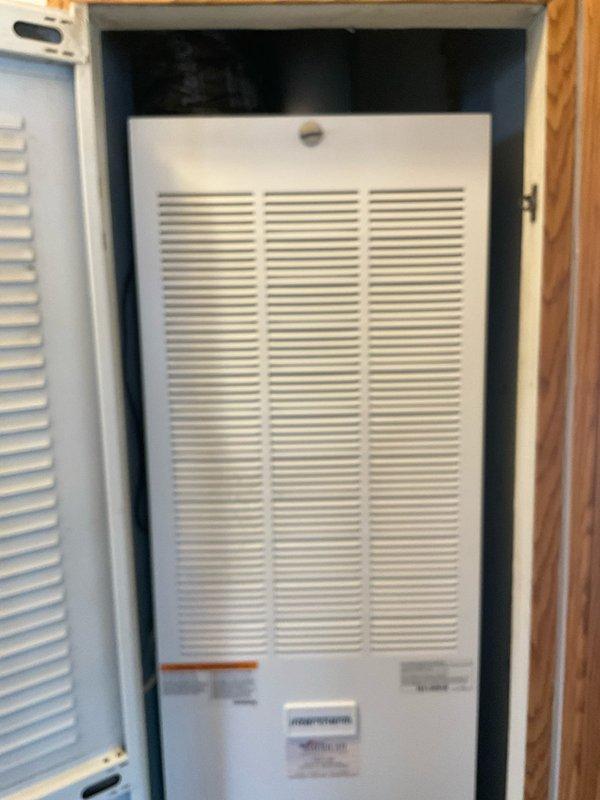 Provided comprehensive HVAC replacement estimate for existing air handler unit located in interior closet space. Evaluated current white metal furnace/air handler installation, assessed mechanical components including blower assembly and drainage system with yellow flexible condensate line, and documented equipment condition showing normal operational wear. Generated multiple quote options (03752-02, 03752-03) for complete system replacement to address customer's cooling and heating needs.