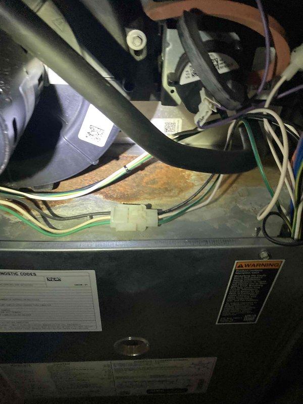 Completed scheduled HVAC maintenance agreement visit performing comprehensive tune-up service on residential heating and cooling system. Inspected interior compartment, verified all electrical connections and wiring secure, examined control module and power supply components for proper operation, and confirmed air filter condition and proper installation. All components found in functional operating condition with normal wear patterns observed.