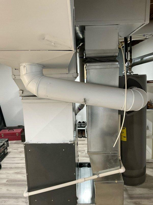 Completed on-site assessment for full HVAC system replacement at single-family residence. Evaluated existing 20-year-old furnace located in basement and 10-year-old central air conditioning unit positioned outside. Documented current split system configuration serving entire home, photographed existing equipment installation including furnace with control panel, PVC ventilation piping, metal ductwork transitions, and air handler components. Provided comprehensive replacement estimate for planned upgrade of both heating and cooling equipment.