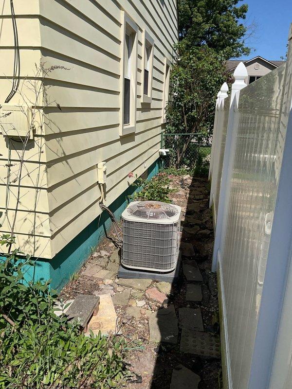 Completed estimate for mini split installation on second floor of residential property. Evaluated exterior placement for condenser unit in side yard area with existing paved access and assessed interior wood-paneled room with skylight for indoor air handler mounting. Provided recommendations for equipment sizing, placement considerations, and installation requirements for the two-zone system.