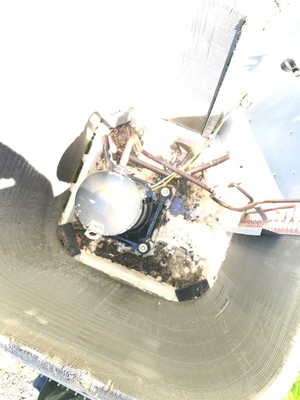 # HVAC Maintenance Agreement Visit - AC&SI

Completed preventive maintenance inspection on residential Carrier air conditioning system per club membership agreement. Performed comprehensive system evaluation including outdoor condenser unit assessment. During inspection, discovered severe mechanical failure of condenser fan motor assembly with extensive damage to housing, blade, and mounting components. Fan motor showed complete deterioration with significant rust, corrosion, and structural compromise rendering unit non-operational. Documented equipment condition with photographic evidence showing failed components and damage extent. Condenser unit exterior and surrounding area appeared well-maintained with adequate clearance from landscaping. Refrigerant lines intact without visible damage. Provided customer with findings and recommended immediate replacement of failed fan motor assembly to restore system functionality and prevent further damage to compressor and other components.