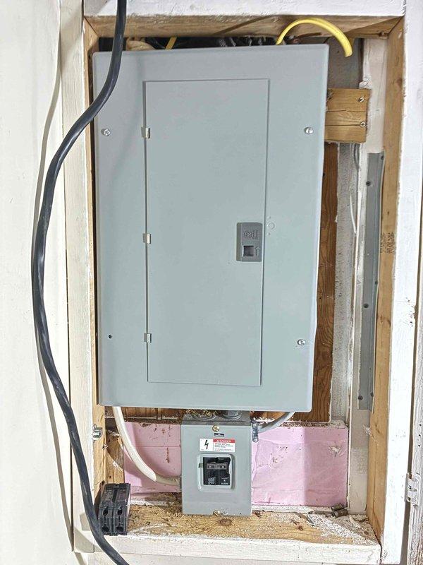 Conducted on-site evaluation for HVAC system replacement estimate. Documented existing electrical service panel with 200-amp breaker box and disconnect, noting proper conduit routing and meter installation. Assessed current AOsmith Signature 100 water heater installation with copper supply lines, shut-off valves, and PVC drainage connections in utility room. Photographed equipment configurations and mechanical room layout to provide comprehensive system replacement proposal for single component estimate.