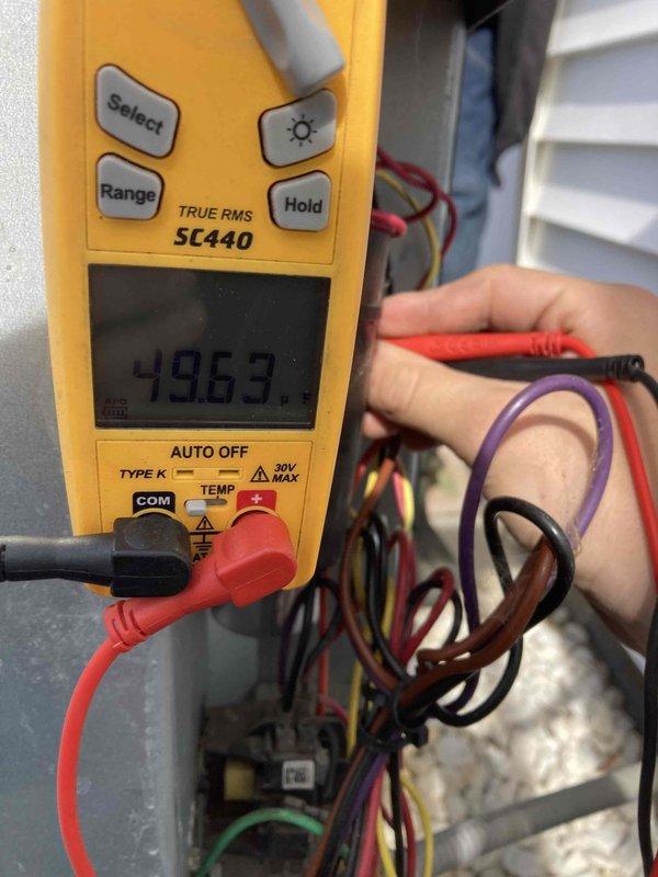 Completed seasonal air conditioning maintenance and system inspection under club agreement. Performed electrical diagnostics using digital multimeter, recording voltage readings of 496.3V on system components, and inspected control wiring connections within the equipment cabinet. Found evaporator coil and air filter heavily clogged with dust and debris accumulation, restricting airflow through the system; filter requires immediate replacement to restore proper system operation and efficiency.