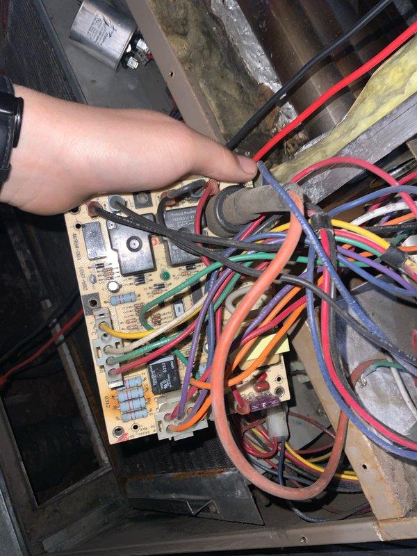# HVAC Service Completion

Responded to no-cooling complaint on aging residential air conditioning system. Upon arrival, confirmed unit was blowing warm air with no refrigeration cycle operation. Conducted visual inspection of evaporator coil assembly and found significantly deteriorated cabinet interior with extensive surface degradation, peeling insulation, and accumulated debris affecting airflow efficiency.

Accessed control board compartment and performed electrical diagnostics on multi-relay control system. Tested voltage at all terminal connections and verified proper power supply to board. Inspected numerous control wiring connections across multiple circuits including thermostat wiring, safety controls, and component connections. Evaluated condition of capacitors, relays, and other electrical components mounted to control board.

Given the age of the system (10+ years) and the extent of deterioration observed in the cabinet interior, discussed system condition and repair optio