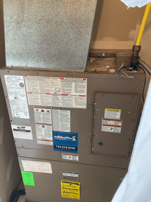 Completed on-site estimate for Magic Pak HVAC system replacement in basement utility area. Evaluated existing beige-cased combination unit, documented current equipment specifications and installation configuration, and captured detailed photographs of unit condition, labeling, and surrounding installation space for replacement quote preparation.