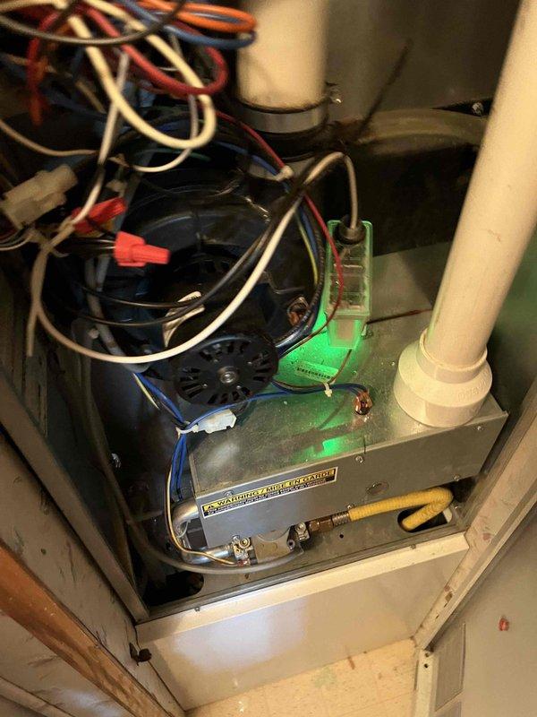 Completed annual AC club maintenance inspection on residential HVAC system. Performed comprehensive visual inspection of furnace and air handler components, including blower motor assembly, electrical connections, control board housing, and condensate drainage system. All wire connections were secure with proper wire nuts in place. System components showed normal age-related wear with minor dust accumulation. Noted thermostat may require replacement or evaluation due to potential operational issues. Documented equipment condition with photographs for service records.