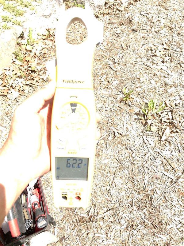 Responded to service call for insufficient cooling on upstairs zone of 10-year-old Lennox central air conditioning system. Performed diagnostic testing and measured refrigerant temperatures using calibrated digital instruments, obtaining reading of 622°F at outdoor unit. Based on abnormally high temperature measurement, identified compressor overheating issue requiring further evaluation of refrigerant charge levels, potential compressor failure, or electrical component malfunction affecting system performance.