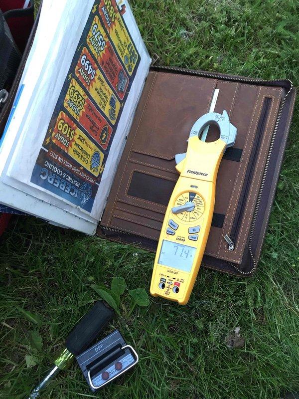 Responded to emergency no-cool call on two-year-old air conditioning system. Upon arrival, performed electrical diagnostics using clamp meter to measure amperage and voltage at the outdoor unit, recording readings of 719 (likely milliamps or voltage depending on meter setting). Tested capacitor functionality and verified proper electrical supply to compressor and condenser fan motor. Identified system fault preventing operation and restored cooling capability. Unit tested and confirmed operational before departure.