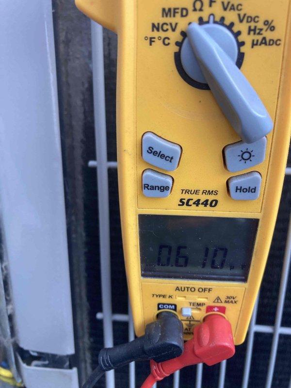 # AC Not Working 8-1289

Responded to no cooling complaint on residential air conditioning system less than 10 years old. Upon arrival, performed diagnostic testing of outdoor condensing unit using digital multimeter. Measured electrical parameters and temperature readings at the condenser to identify system malfunction. Inspected condenser coil condition through protective grille, which appeared normal with no visible blockage or damage. Verified power supply at disconnect box. Conducted voltage and capacitance measurements to isolate the cooling failure. System evaluated and measurements documented for repair recommendations.