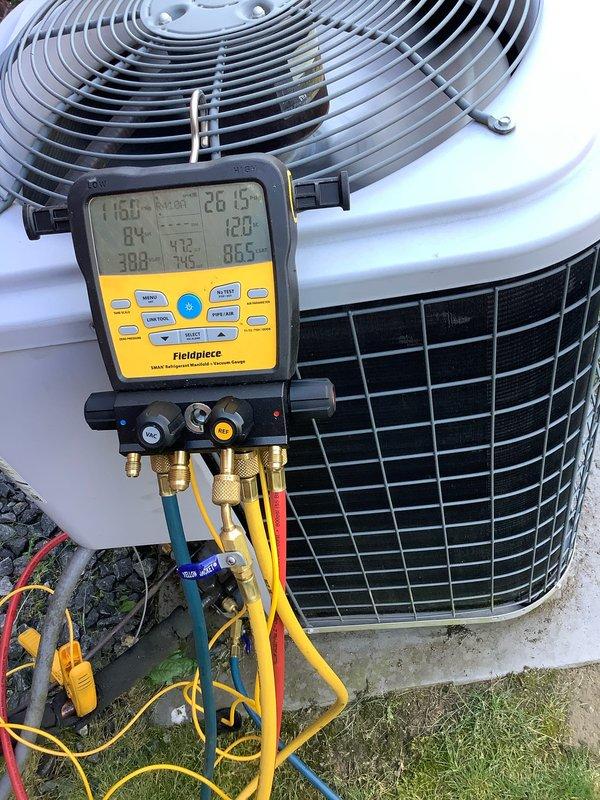 Completed scheduled Club AC8-12 maintenance agreement visit for air conditioning system and supporting indoor equipment. Performed comprehensive system diagnostics using manifold gauges to verify refrigerant pressures and system performance on outdoor condensing unit. Inspected indoor air handler and furnace unit, documented equipment condition with service photos, and confirmed all components operating within normal parameters.
