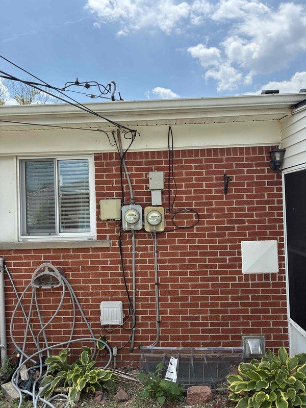 Conducted comprehensive site evaluation for complete HVAC system replacement at single-story residential property. Documented existing exterior electrical infrastructure, utility meter locations, and available mounting space on brick facade to determine optimal placement for new condensing unit and electrical disconnects. Assessed current electrical service capacity and conduit routing to ensure compatibility with replacement equipment specifications.