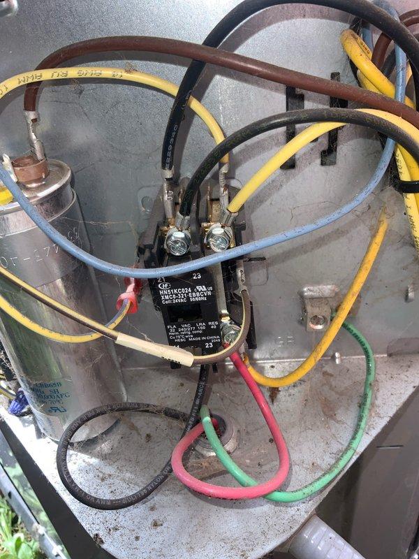# HVAC Service Call - No Cooling Condition

Responded to service call for air conditioning unit not cooling properly. Customer reported system not maintaining desired temperature and suspected low refrigerant charge.

Upon arrival, performed visual inspection of outdoor condensing unit and indoor air handler. Unit age confirmed at over 10 years old. Accessed refrigerant line connections and electrical components for diagnostic evaluation.

Inspected refrigerant line set connections, noting multiple service hoses and gauges had been previously attached, indicating prior service history. Examined brass fittings and connection points for signs of refrigerant leakage. Checked electrical connections at capacitor and relay components.

Evaluated blower assembly and ductwork connections at air handler. Inspected interior cabinet components and mounting hardware. All accessible areas examined for proper operation and potential failure points.

System evaluated for refrigerant charge levels, ai
