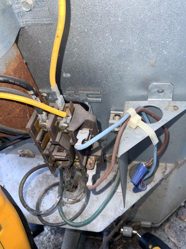 Responded to no cooling complaint on residential air conditioning system. Upon inspection, found significant corrosion and oxidation on contactor assembly and internal electrical components within outdoor unit control panel. Contactor showed brownish-orange discoloration indicating electrical resistance and failure, preventing compressor from operating properly. Fans operated normally, confirming power supply to unit, but compressor circuit was compromised due to corroded contacts. Replaced failed contactor and inspected all electrical connections for integrity. Cleaned corrosion from mounting surfaces and terminal connections. Verified proper voltage at all connection points and confirmed compressor operation. System restored to normal cooling operation with all components functioning as designed.