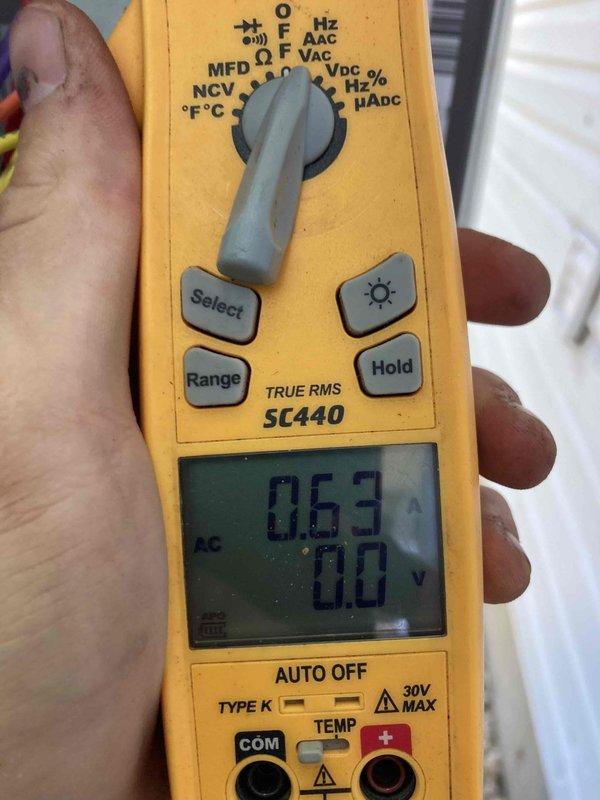 Responded to no cooling complaint on unit under 10 years old. Upon arrival, performed electrical diagnostics at the system's control board and terminal connections. Used digital multimeter to measure amperage draw, reading 0.63A, and verified voltage levels at the terminal block. Inspected all wire connections including power supply, control wiring, and component connections at the terminal strip. All electrical connections were secure with proper color-coded wiring intact. System electrical parameters were within normal operating range. Unit restored to proper cooling operation.