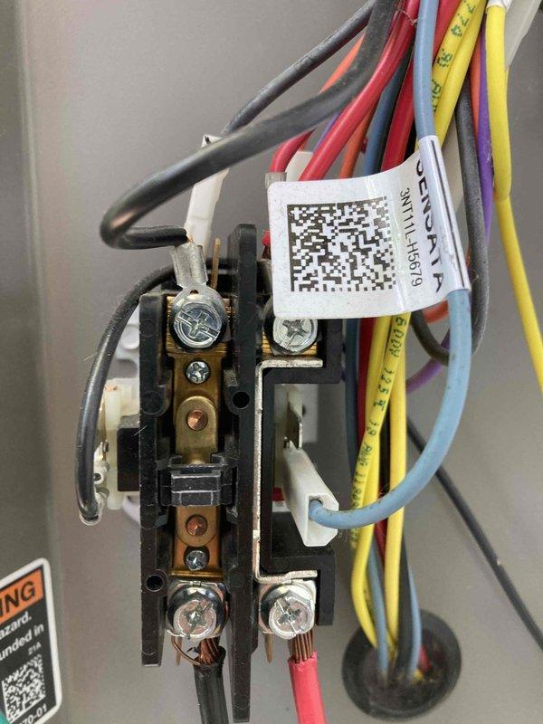 Responded to no cooling complaint on unit under 10 years old. Upon arrival, performed electrical diagnostics at the system's control board and terminal connections. Used digital multimeter to measure amperage draw, reading 0.63A, and verified voltage levels at the terminal block. Inspected all wire connections including power supply, control wiring, and component connections at the terminal strip. All electrical connections were secure with proper color-coded wiring intact. System electrical parameters were within normal operating range. Unit restored to proper cooling operation.