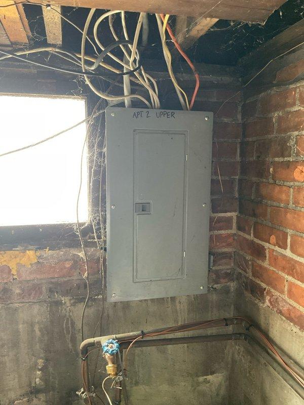 Conducted on-site assessment for HVAC system replacement in upper apartment unit. Documented existing Trane XB90 furnace installation with air handler, including electrical panel configuration, ductwork layout, condensate drainage system, and utility connections in basement mechanical space. Photographed current equipment condition and surrounding infrastructure to provide comprehensive estimate for replacement system.