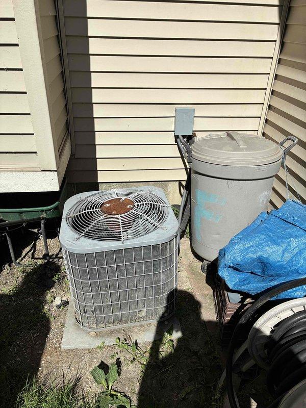 Provided comprehensive estimate for replacement of 23-year-old natural gas furnace and air conditioning system currently located in basement with outdoor condenser unit on concrete pad. Existing equipment remains operational but has reached end of expected service life, with visible corrosion observed on condenser fan assembly and general weathering on outdoor components. Assessed installation requirements including existing ductwork configuration, electrical connections, and equipment placement for proper sizing and replacement recommendations.
