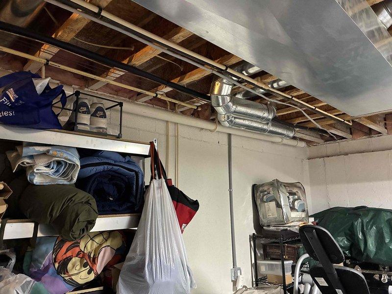 Provided comprehensive estimate for replacement of 23-year-old natural gas furnace and air conditioning system currently located in basement with outdoor condenser unit on concrete pad. Existing equipment remains operational but has reached end of expected service life, with visible corrosion observed on condenser fan assembly and general weathering on outdoor components. Assessed installation requirements including existing ductwork configuration, electrical connections, and equipment placement for proper sizing and replacement recommendations.