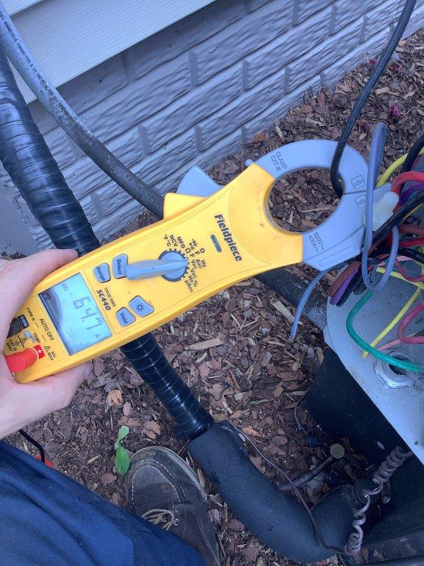 Completed routine maintenance inspection on residential air conditioning system as part of preventative maintenance agreement. Performed diagnostic testing using refrigerant manifold gauge, recording system pressures at 108.5 psia with temperature differentials within normal operating parameters. Measured compressor amperage draw at 57.7 amps to verify electrical performance and confirm unit operating within manufacturer specifications. All readings indicate system functioning properly with no immediate service needs identified.