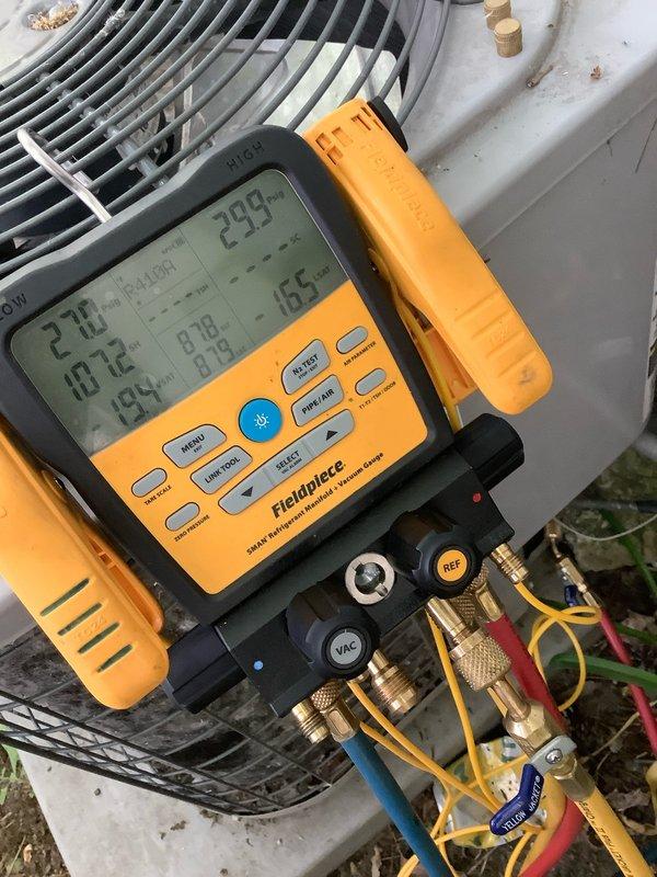 Responded to club AC maintenance call for non-operational system displaying thermostat error code. Connected digital manifold gauges to outdoor condensing unit and performed diagnostic pressure and temperature readings on refrigerant system. System measurements indicated abnormal operating parameters requiring further troubleshooting of thermostat communication fault.