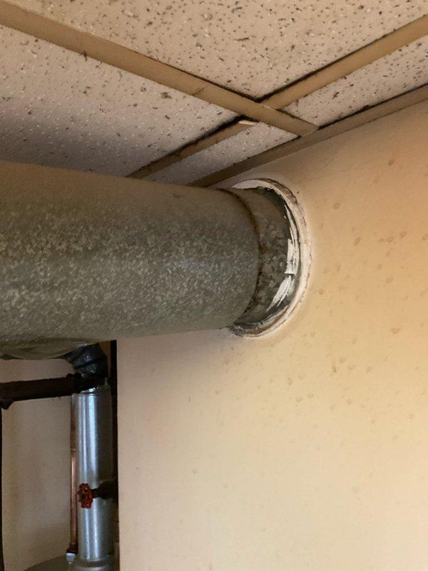 Completed comprehensive boiler system estimate and inspection for commercial facility. Assessed existing water heater installation, including Defender brand unit with associated plumbing connections, pressure relief valves, and copper supply lines. Evaluated insulated ductwork penetration through wall system and documented ceiling infrastructure conditions for proposed boiler replacement project.