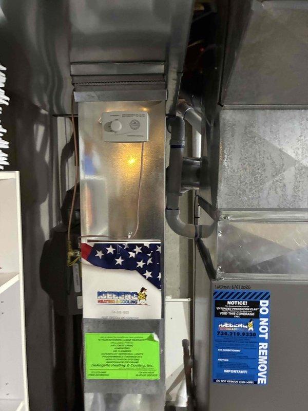 Completed full HVAC system installation including a 70,000 BTU gas furnace and 3-ton air conditioning unit in rear utility room configuration. Installation included mechanical and electrical connections, humidifier integration, refrigerant line set with proper insulation, PVC condensate drain lines, and reconnection of all system components. All equipment labeled, secured, and tested for proper operation per manufacturer specifications.