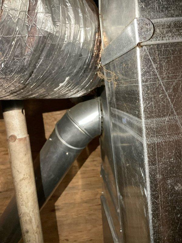 Provided comprehensive estimate for replacement of non-functional 10-12 SEER air conditioning system and older natural gas furnace located at exterior and basement positions respectively. Assessed existing HVAC infrastructure including ductwork distribution system in attic space with reflective insulation showing age-related wear, and evaluated 200-amp electrical service panel in basement utility area to ensure adequate capacity for new equipment installation.