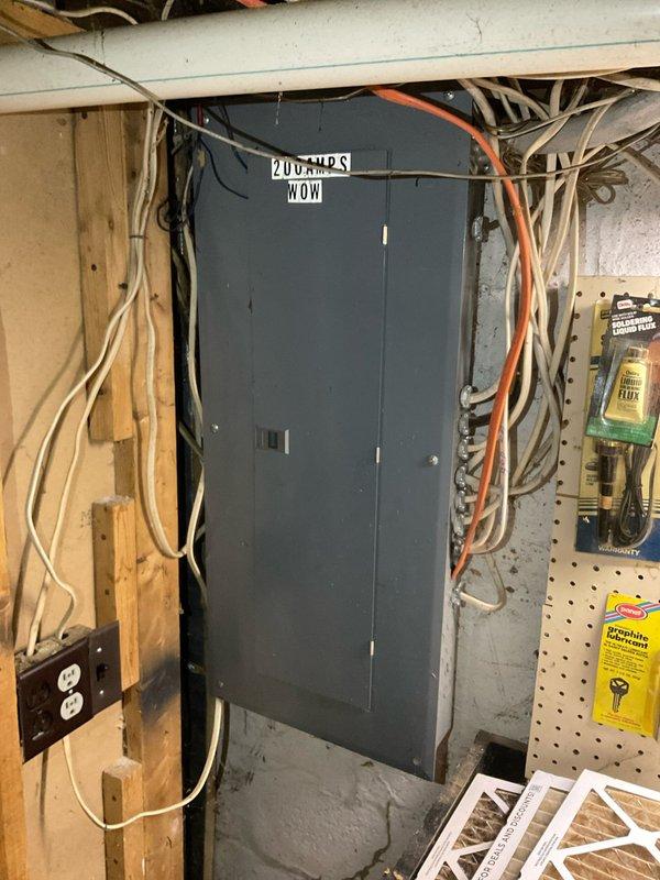 Provided comprehensive estimate for replacement of non-functional 10-12 SEER air conditioning system and older natural gas furnace located at exterior and basement positions respectively. Assessed existing HVAC infrastructure including ductwork distribution system in attic space with reflective insulation showing age-related wear, and evaluated 200-amp electrical service panel in basement utility area to ensure adequate capacity for new equipment installation.