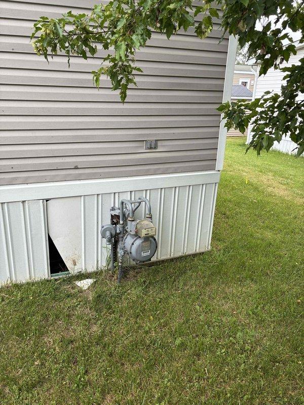 Conducted on-site evaluation for furnace and air conditioning replacement at residential property. Inspected existing white HVAC furnace unit located in interior closet space and assessed exterior gas meter installation and utility connections. Documented current equipment condition, ventilation configuration, and accessibility for replacement installation. Provided comprehensive estimate for complete heating and cooling system replacement based on observed equipment specifications and site conditions.