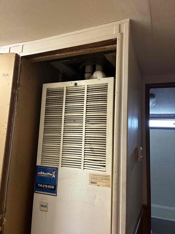 Conducted on-site evaluation for furnace and air conditioning replacement at residential property. Inspected existing white HVAC furnace unit located in interior closet space and assessed exterior gas meter installation and utility connections. Documented current equipment condition, ventilation configuration, and accessibility for replacement installation. Provided comprehensive estimate for complete heating and cooling system replacement based on observed equipment specifications and site conditions.
