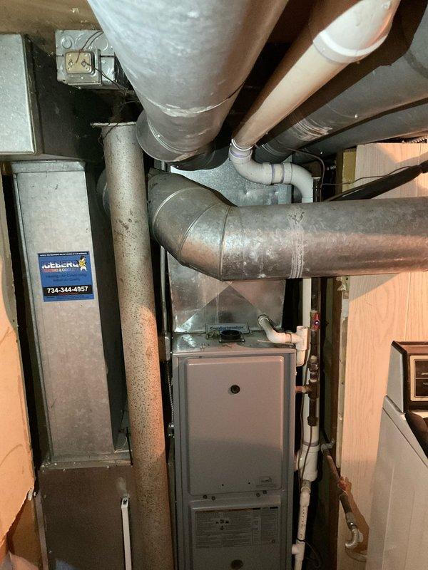 Performed estimate for residential HVAC system replacement. Evaluated 15-year-old flat R-410A air conditioning system that was recharged last year. Upon inspection of outdoor condenser unit on concrete pad and indoor furnace with ductwork in basement, determined system age and condition warrant full replacement rather than additional refrigerant recharge or leak repair services. Documented equipment condition with photographs showing exterior condenser unit, electrical disconnect, indoor furnace, air handler with filter housing, and associated ductwork. Provided replacement recommendation due to system age exceeding typical service life expectancy.