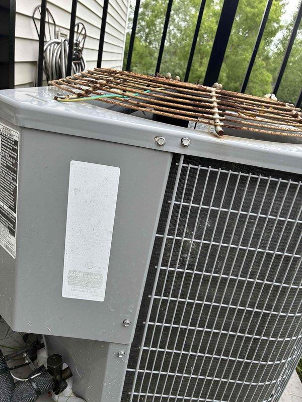 Conducted comprehensive site assessment for complete HVAC system replacement. Evaluated existing Carrier furnace installation in basement utility area and outdoor condensing unit exhibiting severe rust corrosion and weather deterioration on top grille assembly. Documented current system configuration including ductwork connections, refrigerant line routing, electrical controls, and thermostat placement. Prepared multiple equipment replacement quotes covering various system capacity and efficiency options to address failing outdoor unit and coordinate with existing indoor components.