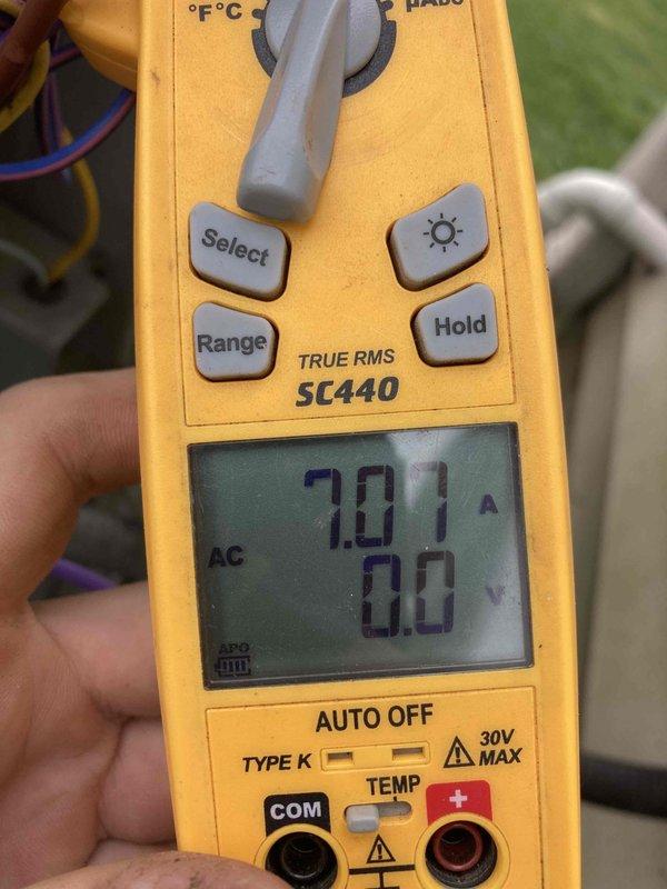 Completed Club AC12-4 preventive maintenance agreement visit on residential air conditioning and heating system. Performed standard system inspection including amperage draw testing on compressor unit, which measured 7.01 amps AC on the outdoor condensing unit, indicating normal operating parameters. Verified and documented humidity control settings on Aprilaire humidifier, confirming proper configuration with dial positions ranging from OFF through 15%, 25%, 35%, and 45% humidity levels with corresponding outdoor temperature recommendations. All equipment operating within manufacturer specifications with no deficiencies noted at time of service.