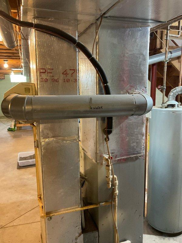 Provided comprehensive estimate for complete HVAC system replacement in basement location. Existing 29-year-old system evaluated with operational natural gas furnace but non-functional air conditioning unit. Assessment included existing Carrier equipment configuration, ductwork connections, and plenum assembly to determine appropriate replacement specifications for both heating and cooling components.