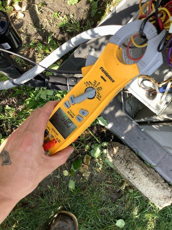 # HVAC Service Completed

Responded to service call for outdoor condensing unit with non-operational condenser fan motor and audible clicking from contactor. Upon arrival, confirmed condenser fan motor was not spinning while compressor was attempting to start. Performed electrical diagnostics using digital multimeter to test voltage supply and component functionality. Measured system pressures and temperatures using refrigerant manifold gauge set to assess overall system operation and refrigerant charge levels.

Testing revealed faulty fan motor requiring replacement. Verified proper voltage at disconnect and contactor terminals. Inspected electrical connections at outdoor unit control panel and confirmed wiring integrity. System diagnostics showed abnormal pressure readings consistent with non-operational condenser fan condition. Replaced defective condenser fan motor with OEM equivalent unit. Verified proper motor rotation direction and secured all electrical connections. Tested capa