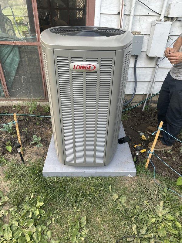 Completed full HVAC system installation including new Lennox air conditioning condenser unit and furnace. Unit was properly positioned on concrete pad with electrical connections secured to exterior wall via conduit, all wiring completed to code, and system tested for proper operation.