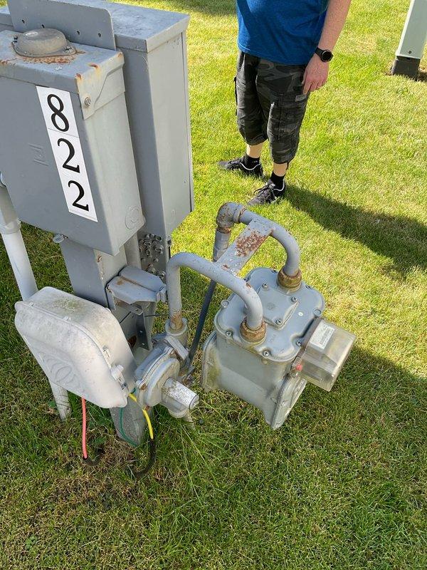 Conducted on-site assessment for replacement of non-functional outdoor air conditioning unit. Evaluated existing aged equipment and property conditions, including natural gas fuel system configuration. Generated multiple estimate options (quotes 03788-05, 03788-06, and 03788-08) for complete AC system replacement, documenting current thermostat operation showing indoor temperature at 79°F with cooling setpoint of 72°F, and photographed existing gas meter infrastructure to ensure proper coordination with new equipment installation.