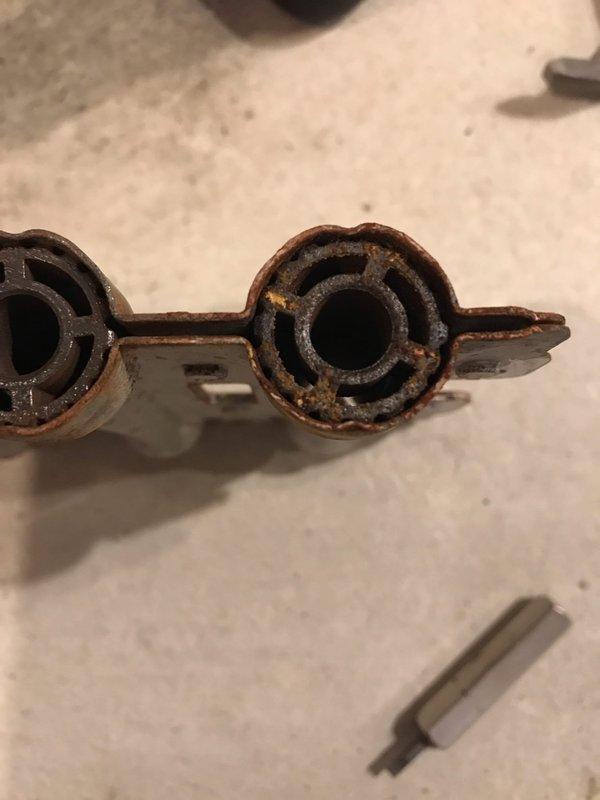 Performed comprehensive tune-up and inspection on furnace and air conditioning system. Upon inspection, discovered severely corroded gas manifold assembly with significant rust deterioration affecting multiple ports and connecting components, which poses potential safety and operational concerns. Documented equipment condition with photographic evidence for service records and future reference.