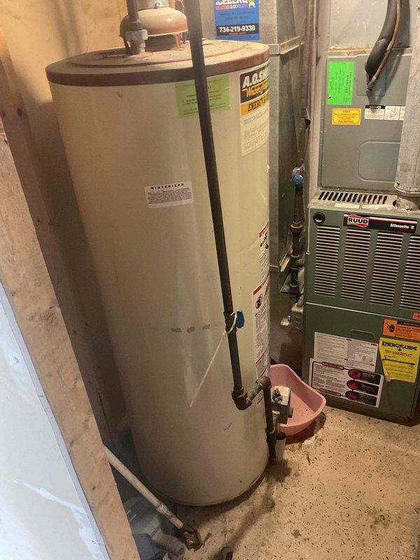 Conducted comprehensive site assessment for HVAC system replacement estimate at residential property. Evaluated existing Ruud furnace unit and outdoor air conditioning/heat pump system for potential replacement options. Documented current equipment configuration including furnace location in basement utility area with adjacent water heater, electrical connections, and outdoor condensing unit positioned on grade with proper clearances from foundation. Photographed existing installation showing electrical service routing from meter through conduit to outdoor unit, current landscaping conditions, and mechanical room layout. Provided customer with pricing options for both single component AC replacement and complete system replacement including furnace and outdoor unit to address aging equipment and improve energy efficiency.