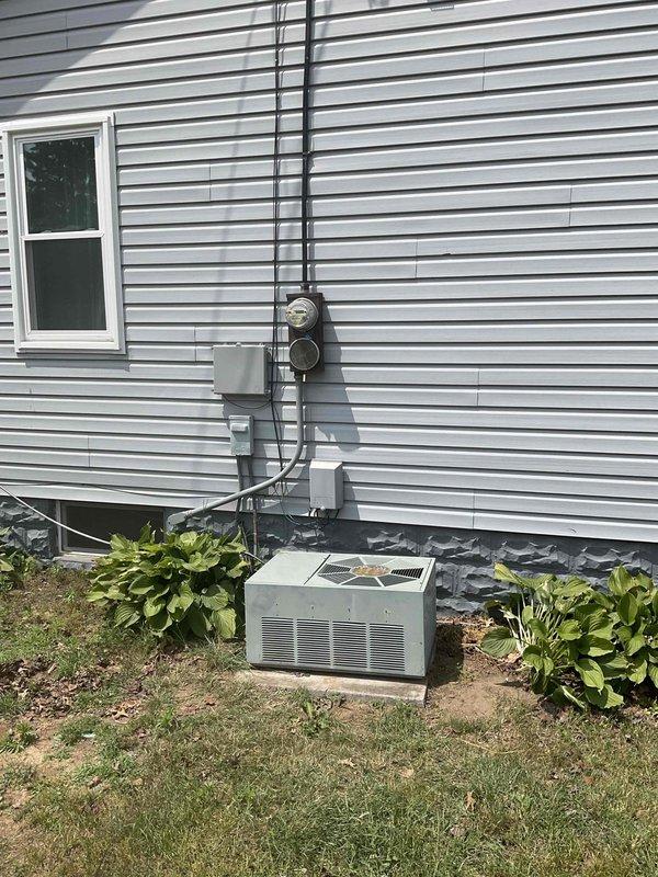 Conducted comprehensive site assessment for HVAC system replacement estimate at residential property. Evaluated existing Ruud furnace unit and outdoor air conditioning/heat pump system for potential replacement options. Documented current equipment configuration including furnace location in basement utility area with adjacent water heater, electrical connections, and outdoor condensing unit positioned on grade with proper clearances from foundation. Photographed existing installation showing electrical service routing from meter through conduit to outdoor unit, current landscaping conditions, and mechanical room layout. Provided customer with pricing options for both single component AC replacement and complete system replacement including furnace and outdoor unit to address aging equipment and improve energy efficiency.