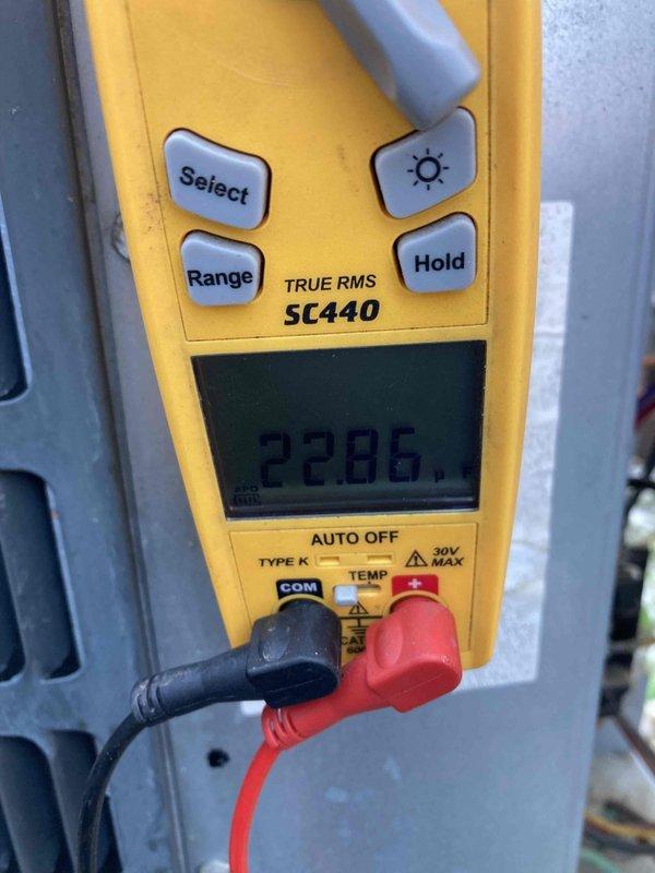 Performed CLUB AC 12-4 preventive maintenance visit. Left voicemail message to coordinate possible rescheduling with member. Conducted diagnostic electrical measurements using digital multimeter, recording voltage and amperage readings to verify system performance parameters within manufacturer specifications.