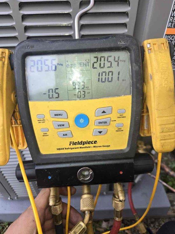 Successfully installed a new 3-ton air conditioning system with matching evaporator coil on the left side of the existing furnace. Connected refrigerant lines to the outdoor condensing unit and performed complete system startup procedures. Verified proper system operation using manifold gauges, confirming refrigerant pressures of 205.0 PSI suction and 205.4 PSI discharge with ambient temperature reading of 100.1°F. All electrical connections completed to manufacturer specifications, including reconnection of thermostat wiring and power supply. System tested and running efficiently with proper airflow through ductwork.