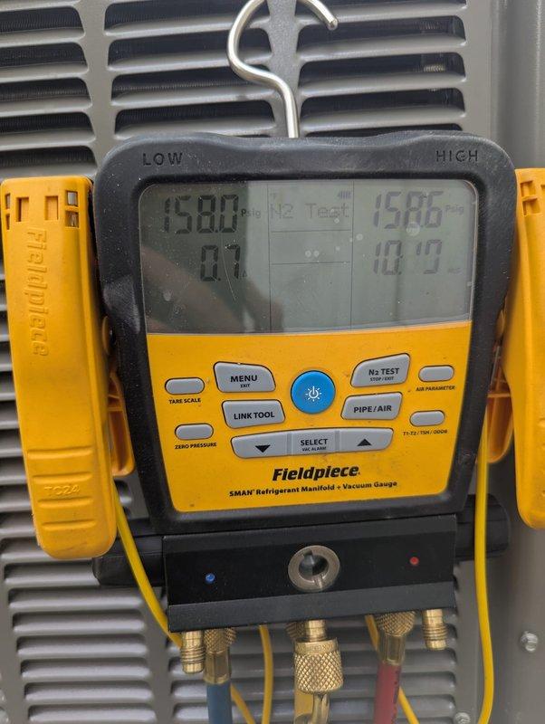 Completed installation of 3-ton air conditioning system at rear location of property. Performed all mechanical and electrical connections required for proper system operation. Conducted vacuum test using digital micron gauge to verify system integrity, achieving proper vacuum levels below 500 microns. Charged system with refrigerant to manufacturer specifications using manifold gauges, verifying proper pressures on both high and low sides. Reconnected all electrical and refrigerant lines, ensuring secure connections at all fittings. System tested and confirmed operational with appropriate temperature differential and proper cycling.