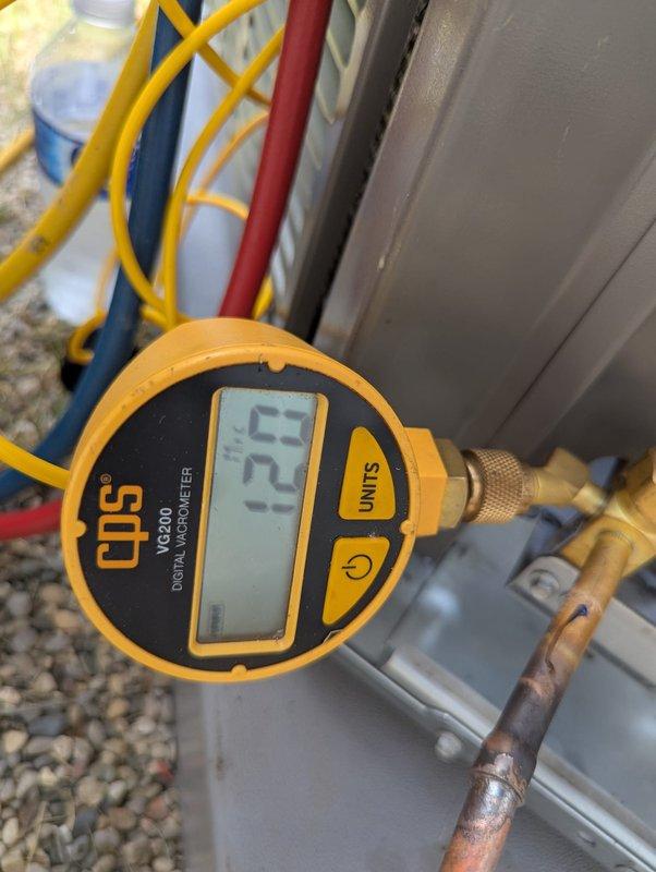 Completed installation of 3-ton air conditioning system at rear location of property. Performed all mechanical and electrical connections required for proper system operation. Conducted vacuum test using digital micron gauge to verify system integrity, achieving proper vacuum levels below 500 microns. Charged system with refrigerant to manufacturer specifications using manifold gauges, verifying proper pressures on both high and low sides. Reconnected all electrical and refrigerant lines, ensuring secure connections at all fittings. System tested and confirmed operational with appropriate temperature differential and proper cycling.