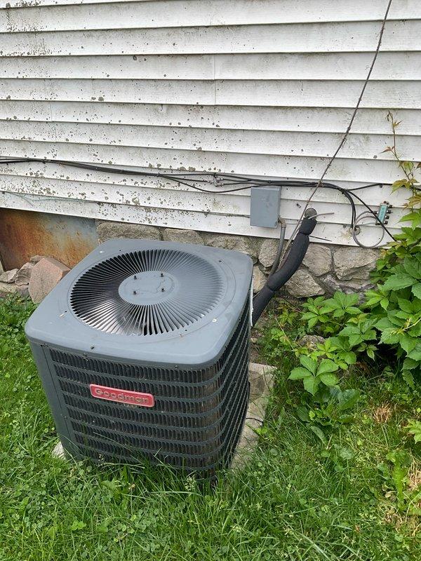 Provided comprehensive HVAC system replacement estimate for property currently operating with original 10+ year old electric furnace only, with no existing air conditioning system. Assessed outdoor installation location adjacent to building exterior with appropriate clearances and electrical infrastructure access. Evaluated indoor air handler placement in utility area with existing condensate drainage system and support framework. Generated two detailed quote options (03794-02 and 03794-03) for complete heating and cooling system installation to replace aging equipment and add air conditioning capacity to meet comfort requirements.
