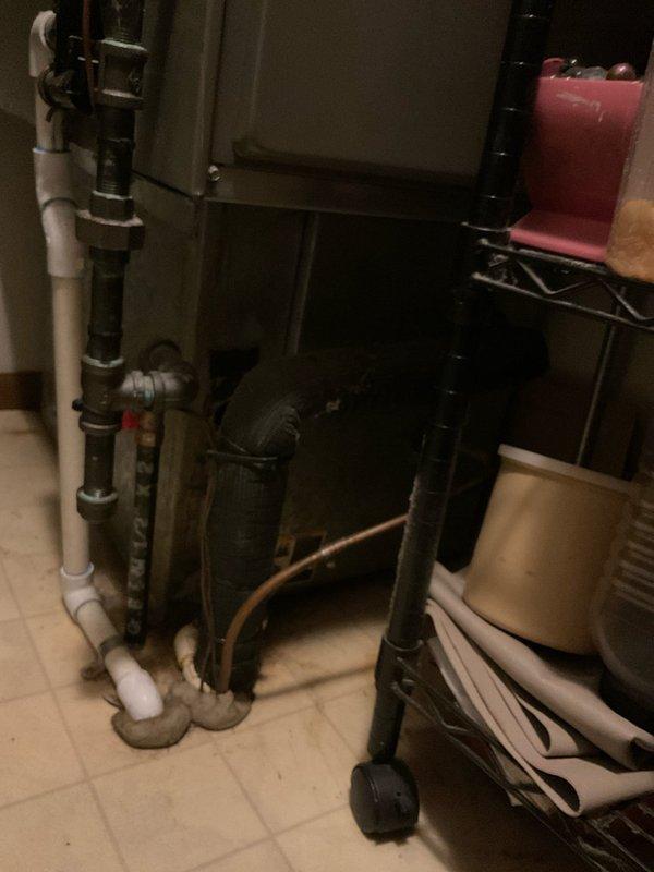 Provided comprehensive HVAC system replacement estimate for property currently operating with original 10+ year old electric furnace only, with no existing air conditioning system. Assessed outdoor installation location adjacent to building exterior with appropriate clearances and electrical infrastructure access. Evaluated indoor air handler placement in utility area with existing condensate drainage system and support framework. Generated two detailed quote options (03794-02 and 03794-03) for complete heating and cooling system installation to replace aging equipment and add air conditioning capacity to meet comfort requirements.