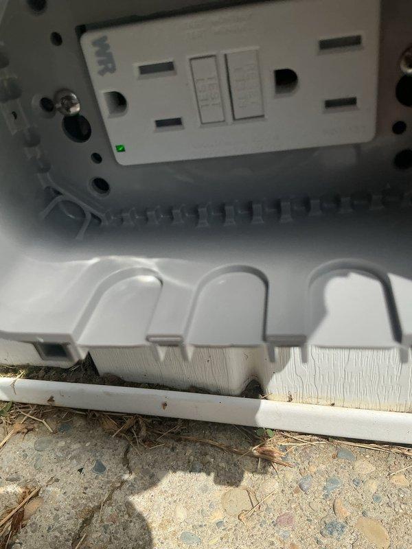 Installed a weather-resistant GFCI receptacle on the exterior of the structure near the HVAC condensate drain pan to provide ground fault protection for outdoor electrical circuits. The outlet was properly mounted and tested, with the green LED indicator confirming normal operation upon completion.
