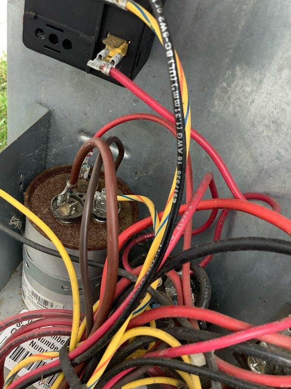 Performed comprehensive AC tune-up and system diagnostics on outdoor condensing unit. Connected digital manifold gauges to measure refrigerant pressures and temperatures, verifying proper system operation and superheat levels. Inspected electrical components and capacitor, noting visible corrosion and rust accumulation on capacitor terminals and connection points that will require monitoring or future replacement to prevent electrical failure.