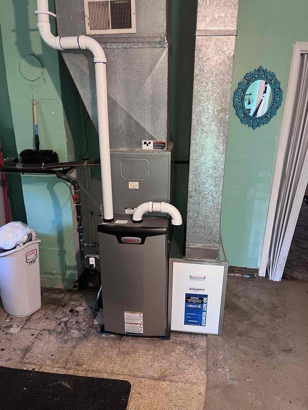 Completed installation of 70,000 BTU furnace system in residential basement utility room, including all mechanical and electrical connections. Installed new air handler unit with galvanized metal housing, connected white PVC venting system for proper exhaust and intake, and reconnected all existing ductwork to new equipment. Verified all electrical connections to code, tested system operation, and confirmed proper airflow throughout the home.